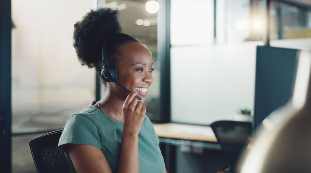 Face, business and woman in call center, telemarketing and customer support in office. Portrait, female agent or consultant with headset, conversation or consulting for digital marketing, crm or help