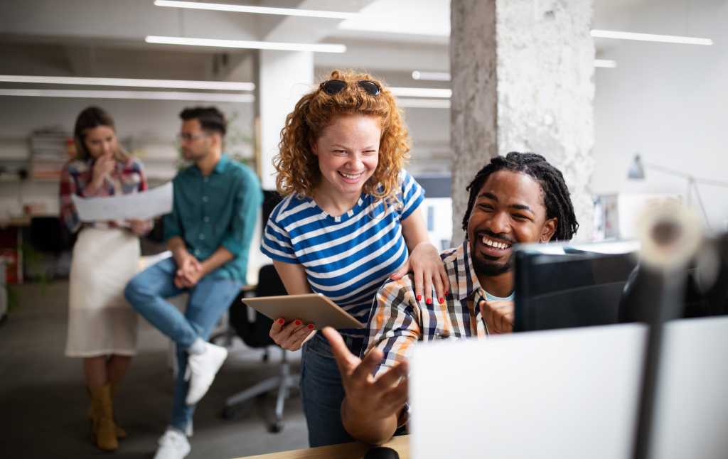 Group of business people and software developers working as a team in office
