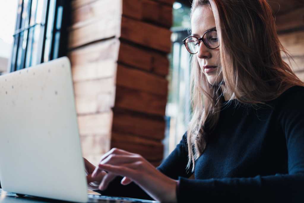 Business woman working with laptop. Freelance concept. Horizontal