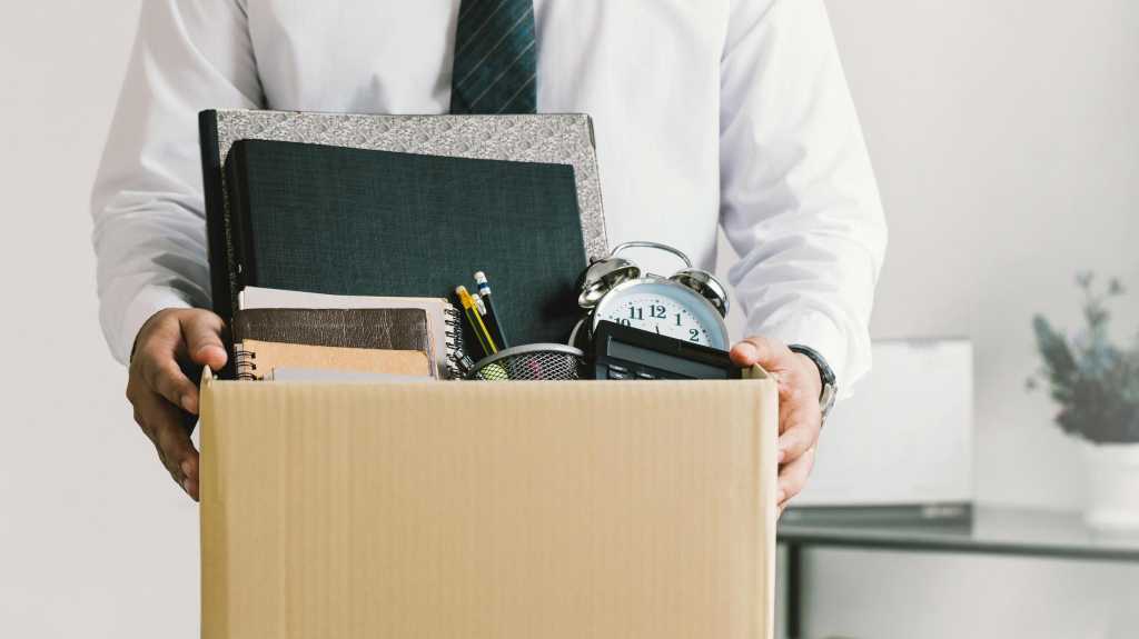 Resignation. businessmen holding boxes for personal belongings and resignation letters.Quitting a job,The big quit.The great Resignation.