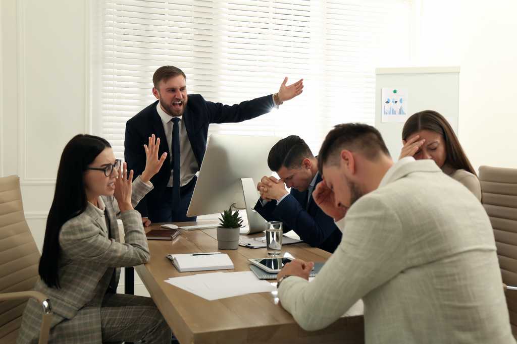 business meeting men women office unhappy frustrated angry