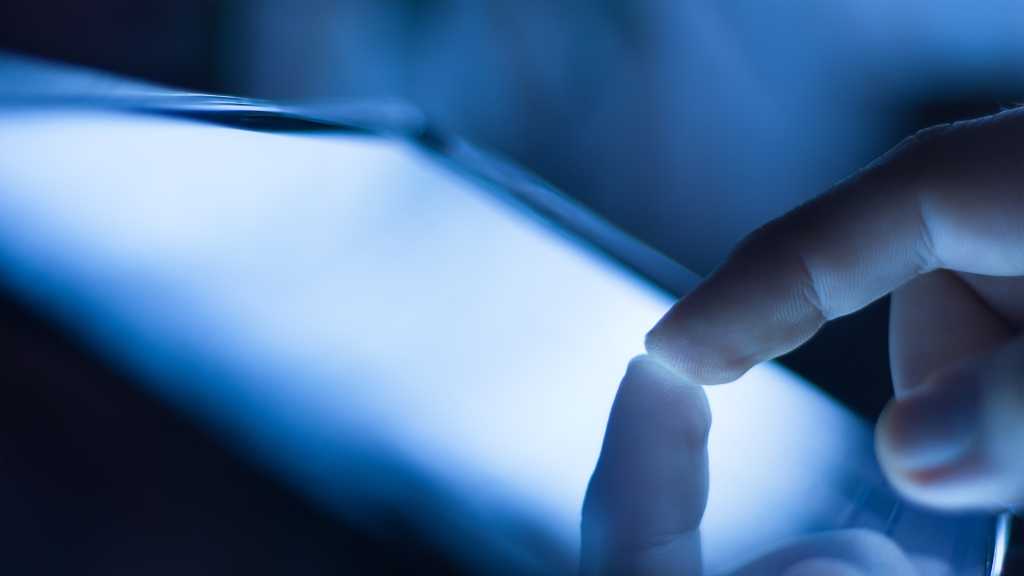 finger touching device screen