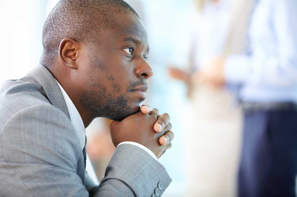 Handsome businessman daydreaming of his business future