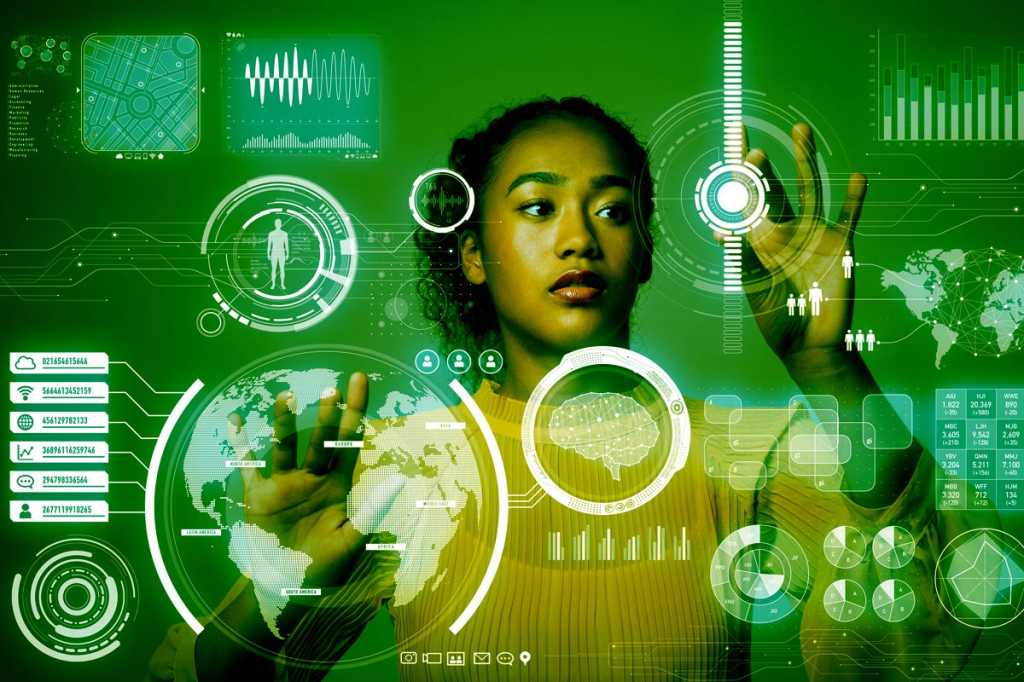 data scientist woman at virtual monitor user interface tools for data science by metamorworks getty