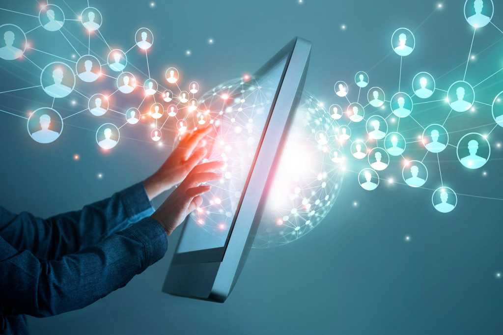 Leading remote teams > A businessman virtually works with a distributed network of teams.