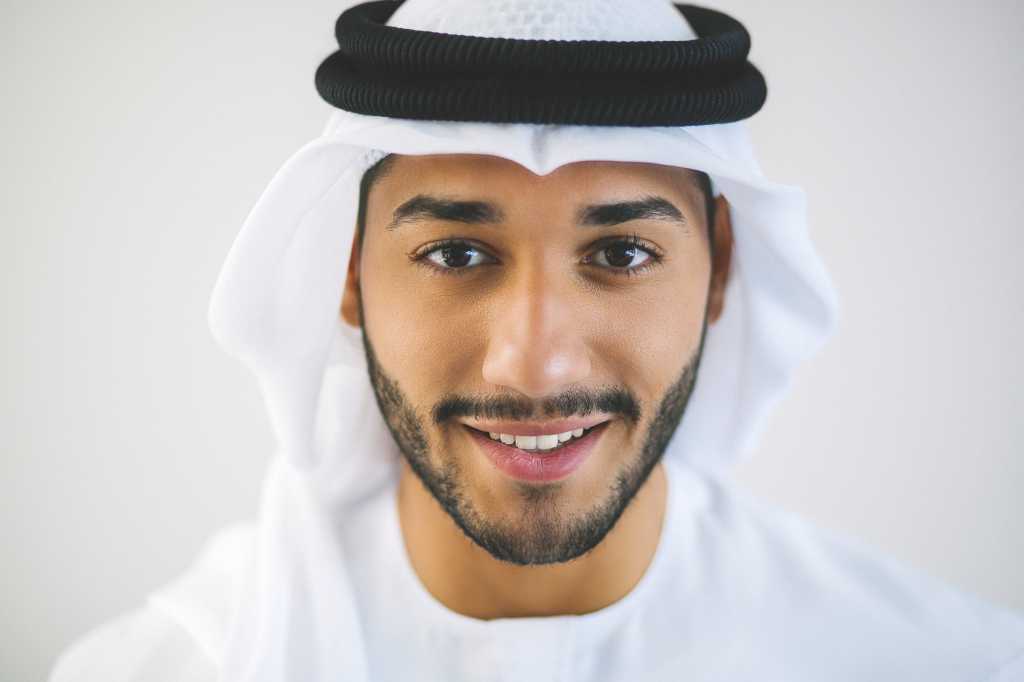 diversity uae young arabic man with binary overlay wearing kandura and kaffiyeh middle east dubai b