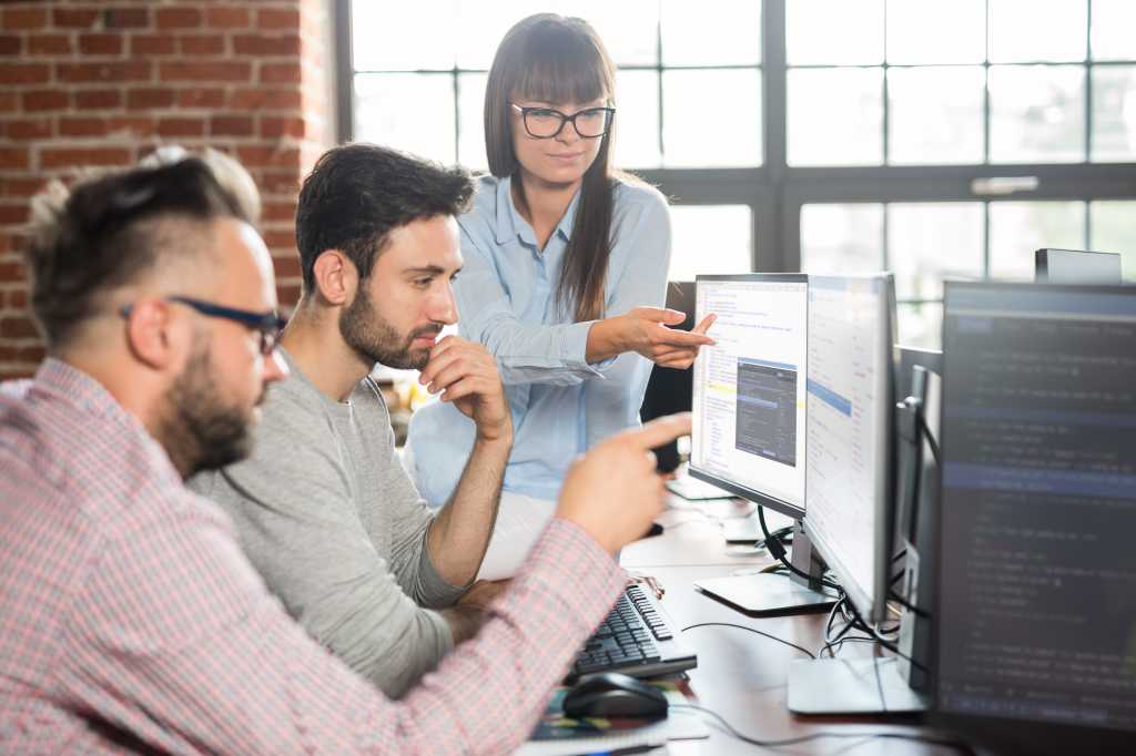 Developing programming and coding technologies. Website design. Programmer working in a software develop company office.