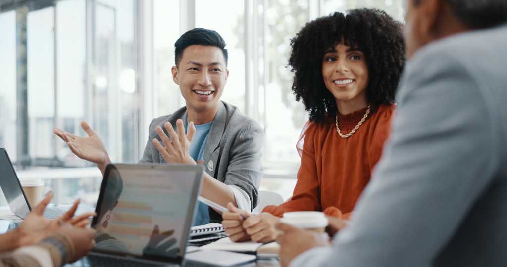 Meeting, collaboration and team planning a project together in the office conference room. Teamwork, diversity and business people in discussion while working on a b2b corporate strategy in workplace