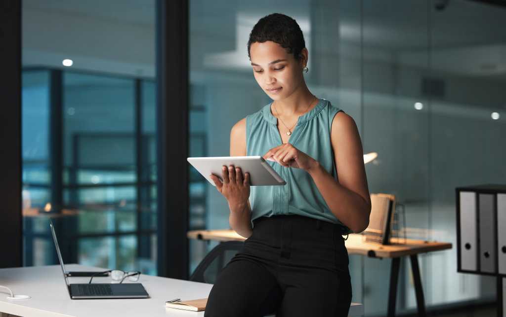 Business, black woman and tablet in office, focus and digital planning for growth, startup and sales. Corporate, African American female employee and manager with device, idea and website launch