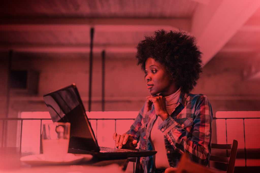 Tech Spotlight   >   Cybersecurity [CW]   >   A remote worker at her laptop.