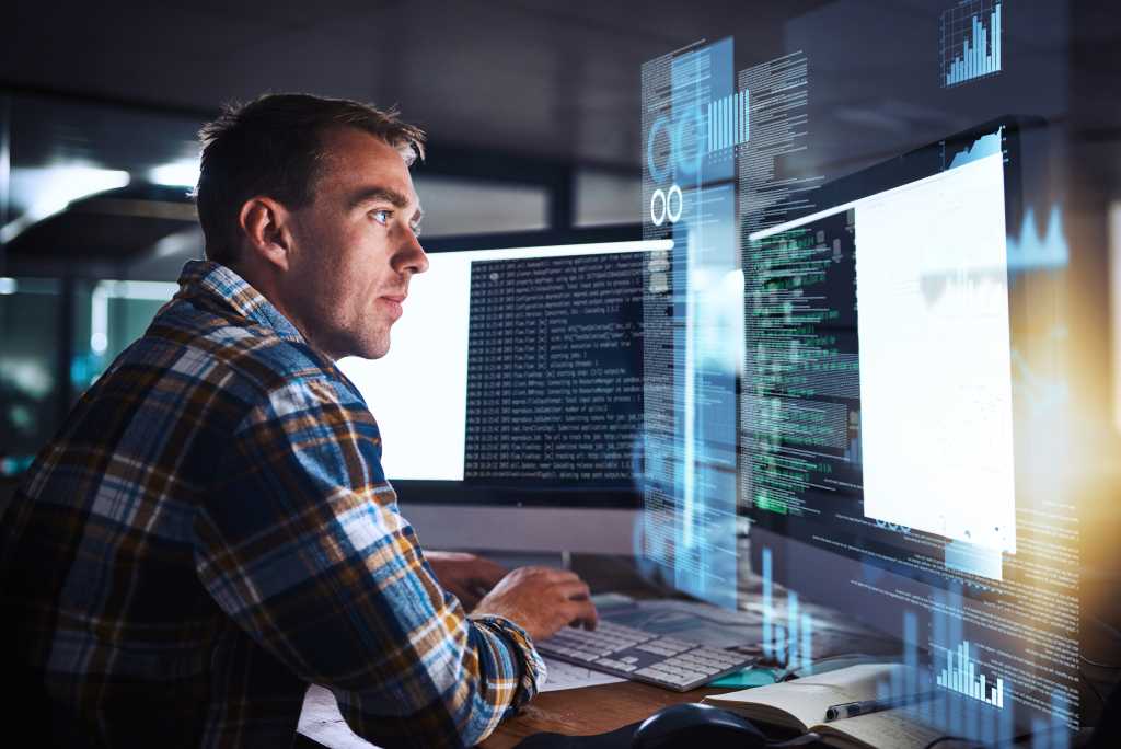 Developer, man and programmer code on computer screen with cybersecurity hologram, analytics and seo or working at night. Technology, coding and hacker on dark software, safety and iot