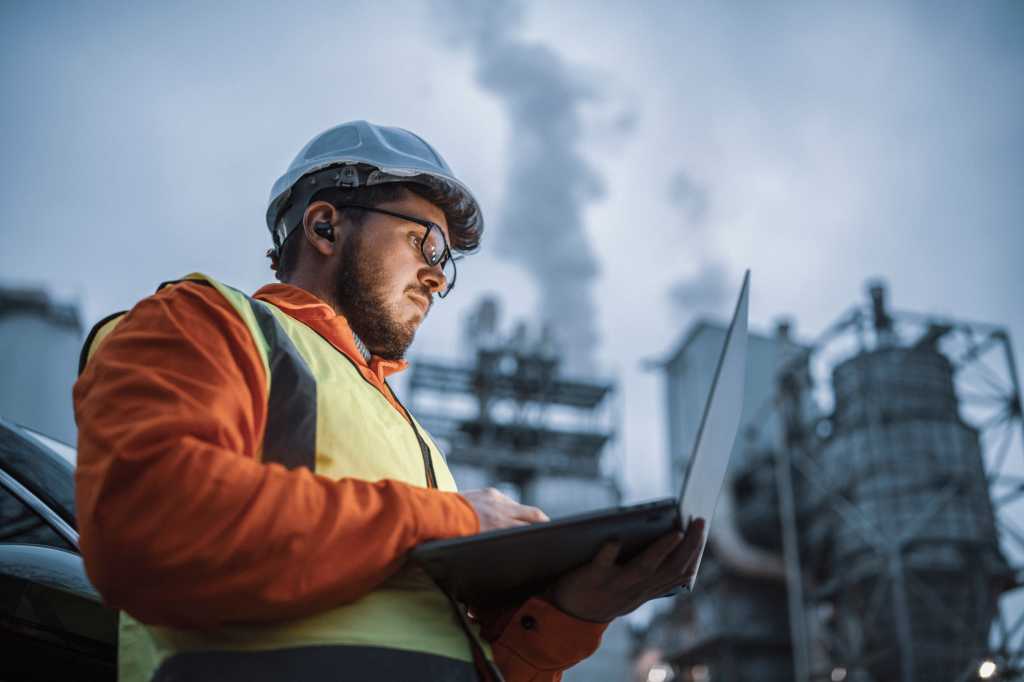 Man on Laptop on Job site