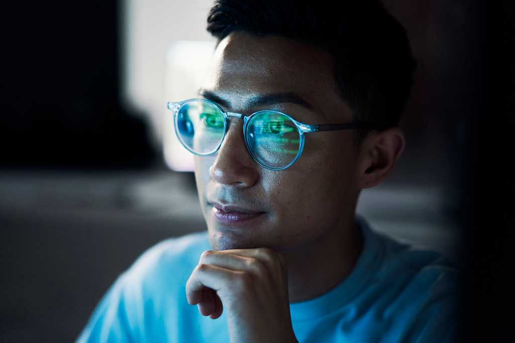Asian man, developer and thinking in coding at night or programming software or application development.