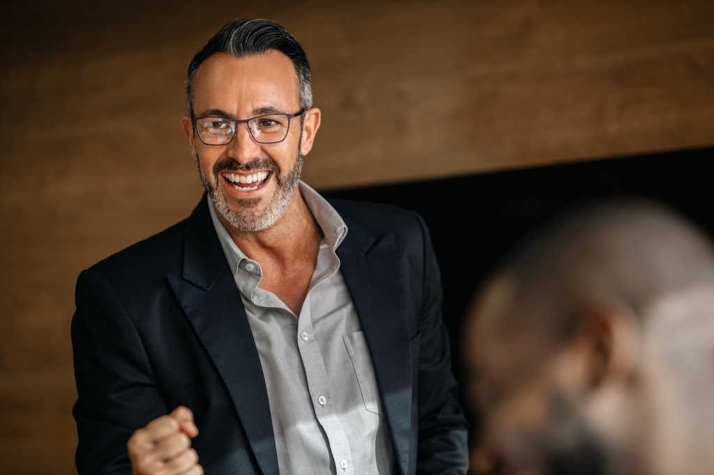 happy and confident senior executive