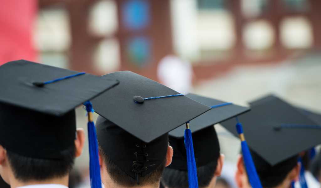 back of graduates during commencement.