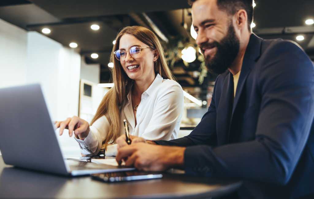 man and woman at computer